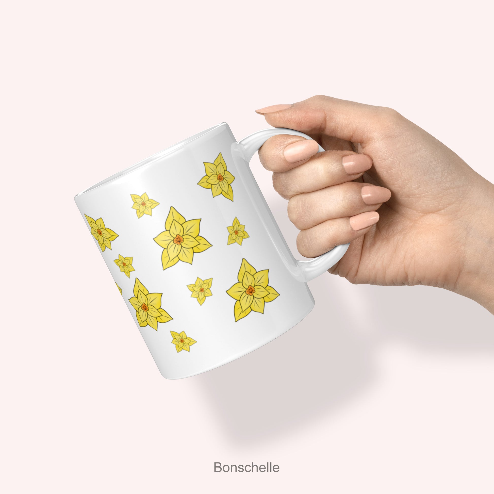a lady's hand holding the Yellow Daffodils Spring Flowers Mug