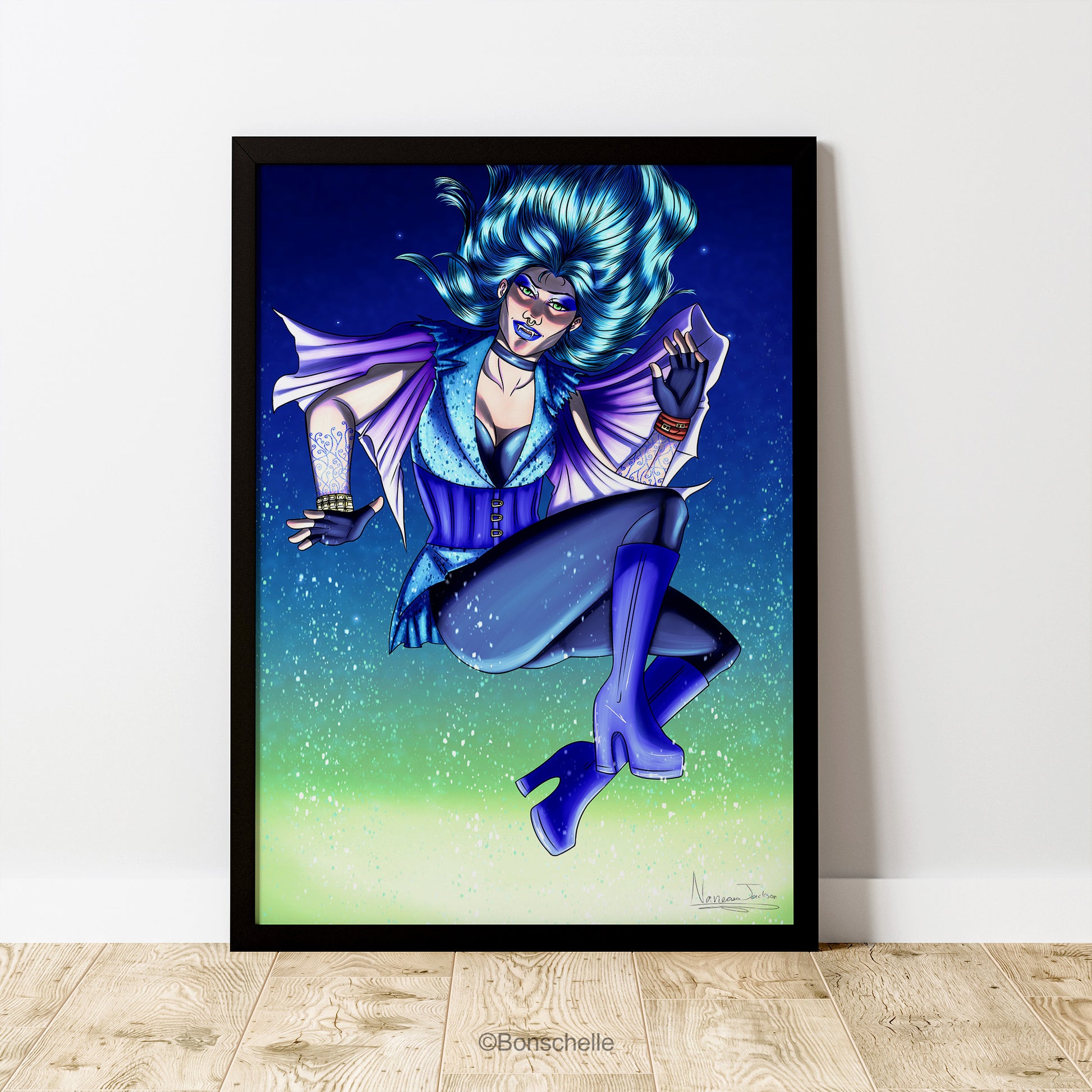 An original art print in which a vampire-witch with electric-blue hair flies in the air while the snow falls. The print is framed in black, sits on a wooden floor against a white wall.