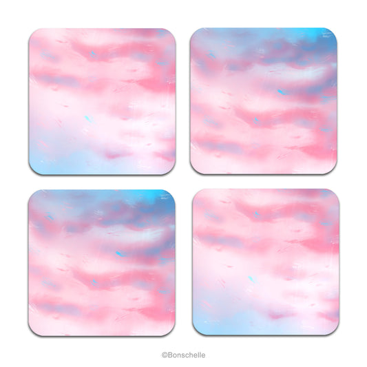 Set of four coasters with original art cloud designs in pinks and blues. Design inspired by colours of Transgender Pride Flag