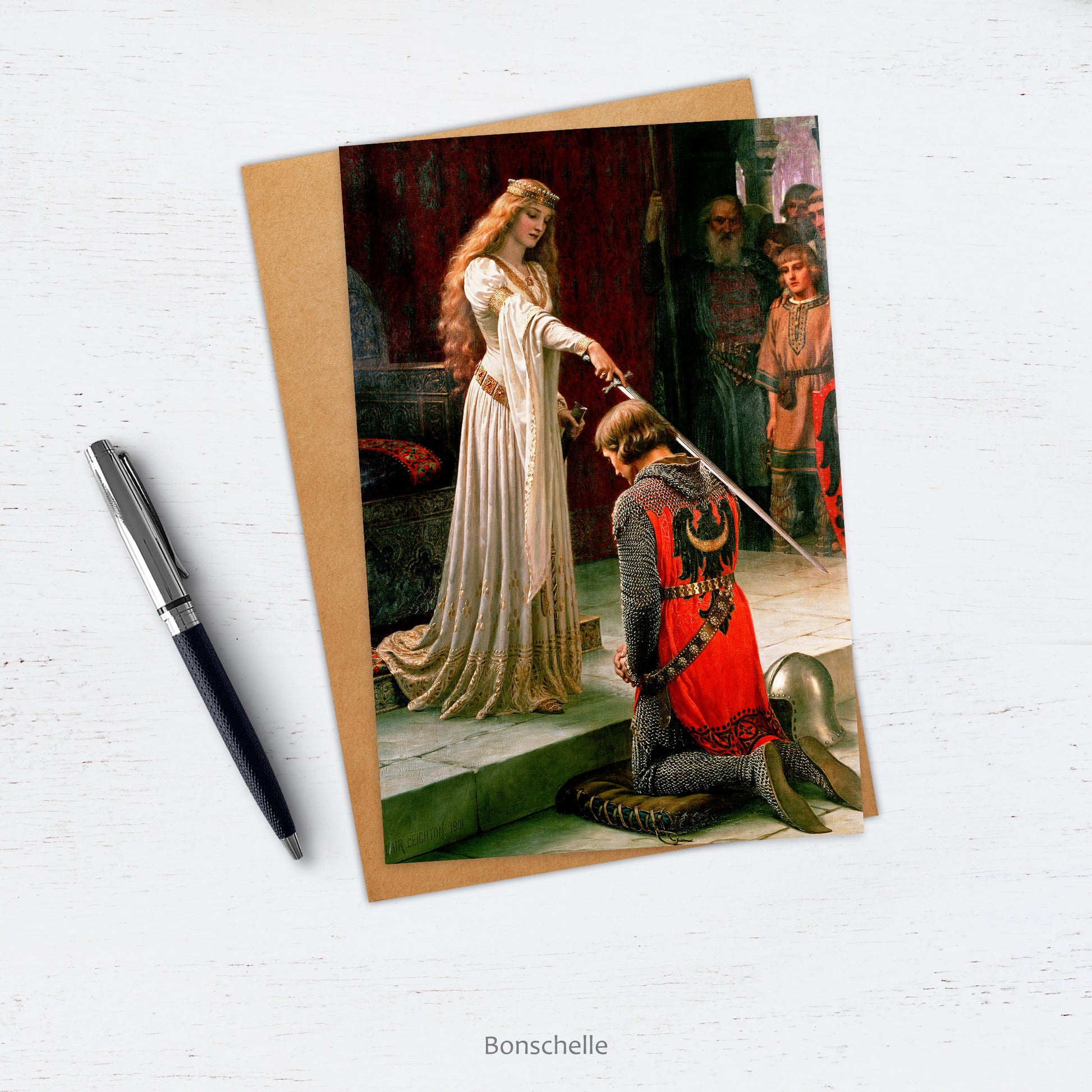 Card and envelope with Pre-Raphaelite image of 'The Accolade' by Edmund Leighton  (1852–1922) on counter top with pen