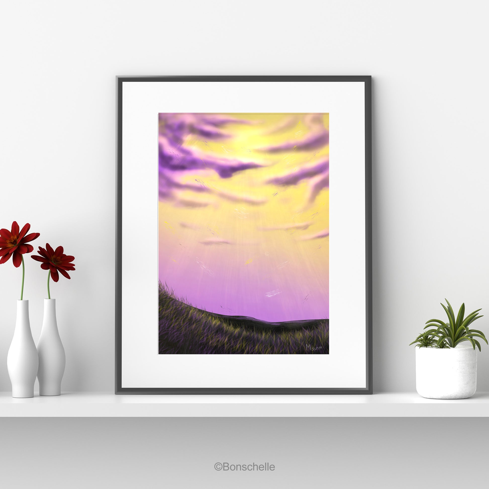 An original art print showing cloud art using the colours of the Non-Binary Pride Flag. The print is mounted on a white surround and framed in black. It sits on a white shelf. On one side are flower vases, on the other a flower pot with a cactus.