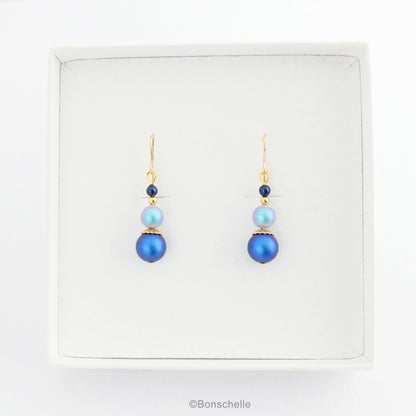 Blue swarovski crystal pearl beaded drop earrings with 14K gold filled earwires for women with gold accents shown in a jewellery box
