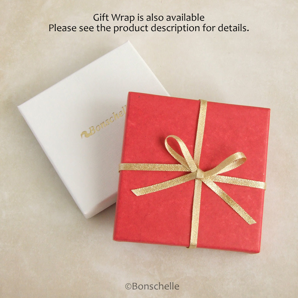 Example of bonschelle red tissue and gold bow gift wrap. 