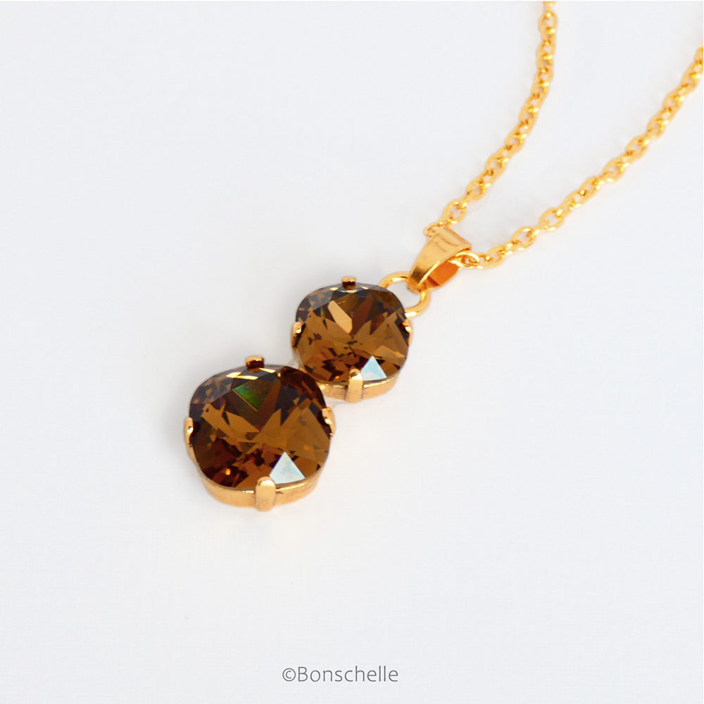 side view of Bronze_Topaz_cushion_cut_crystal_necklace_1.jpg  1000 × 1000px  Bronze toned couble cushion cut crystal necklace for women