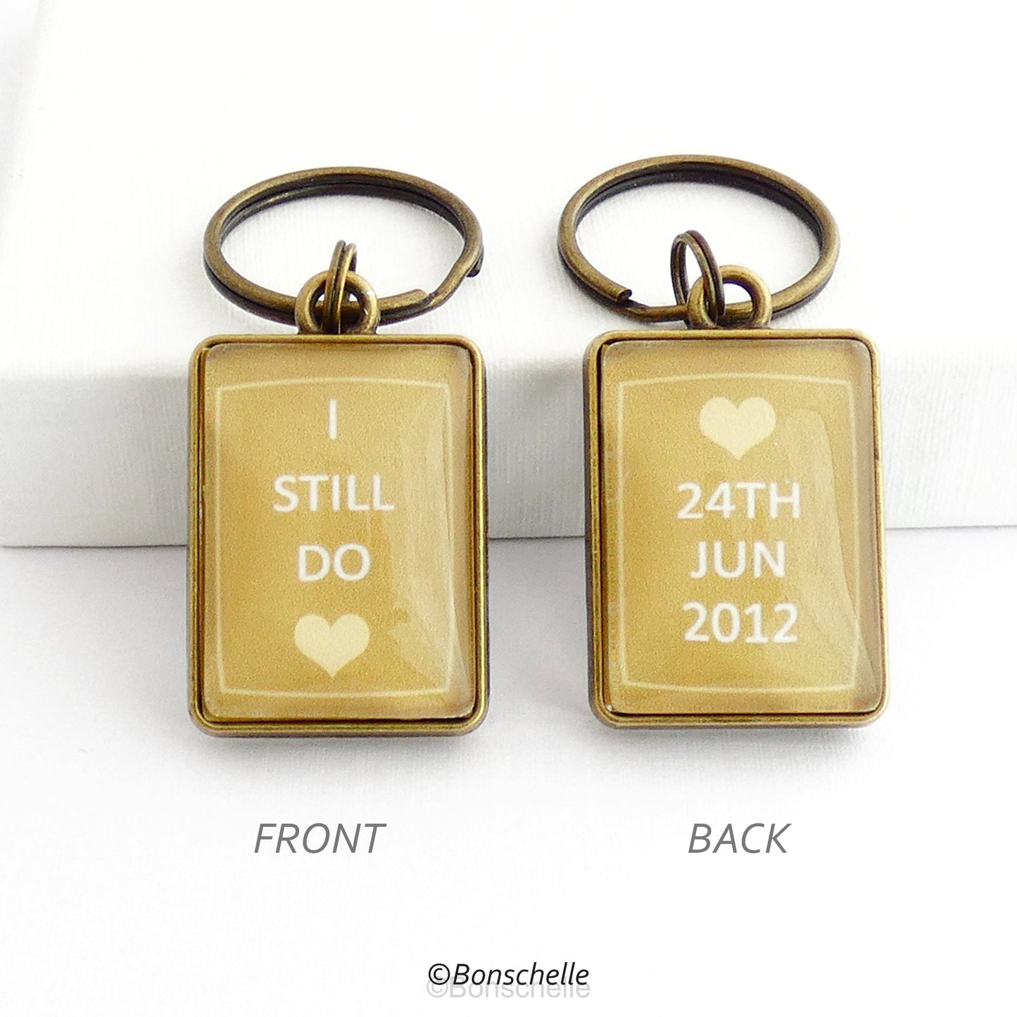 bronze toned metal and glass cabochon rectangle shape keyring for bronze anniversary with personalised date and the worlds I still do