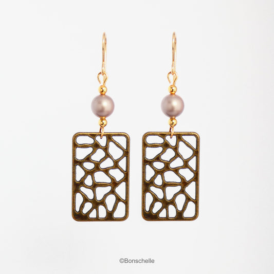 Handmade earrings made with rectangular shaped antique bronze filigree style charms, Swarovski simulated pearls in a light almond shade, gold toned beads and 14K gold filled earwires. 