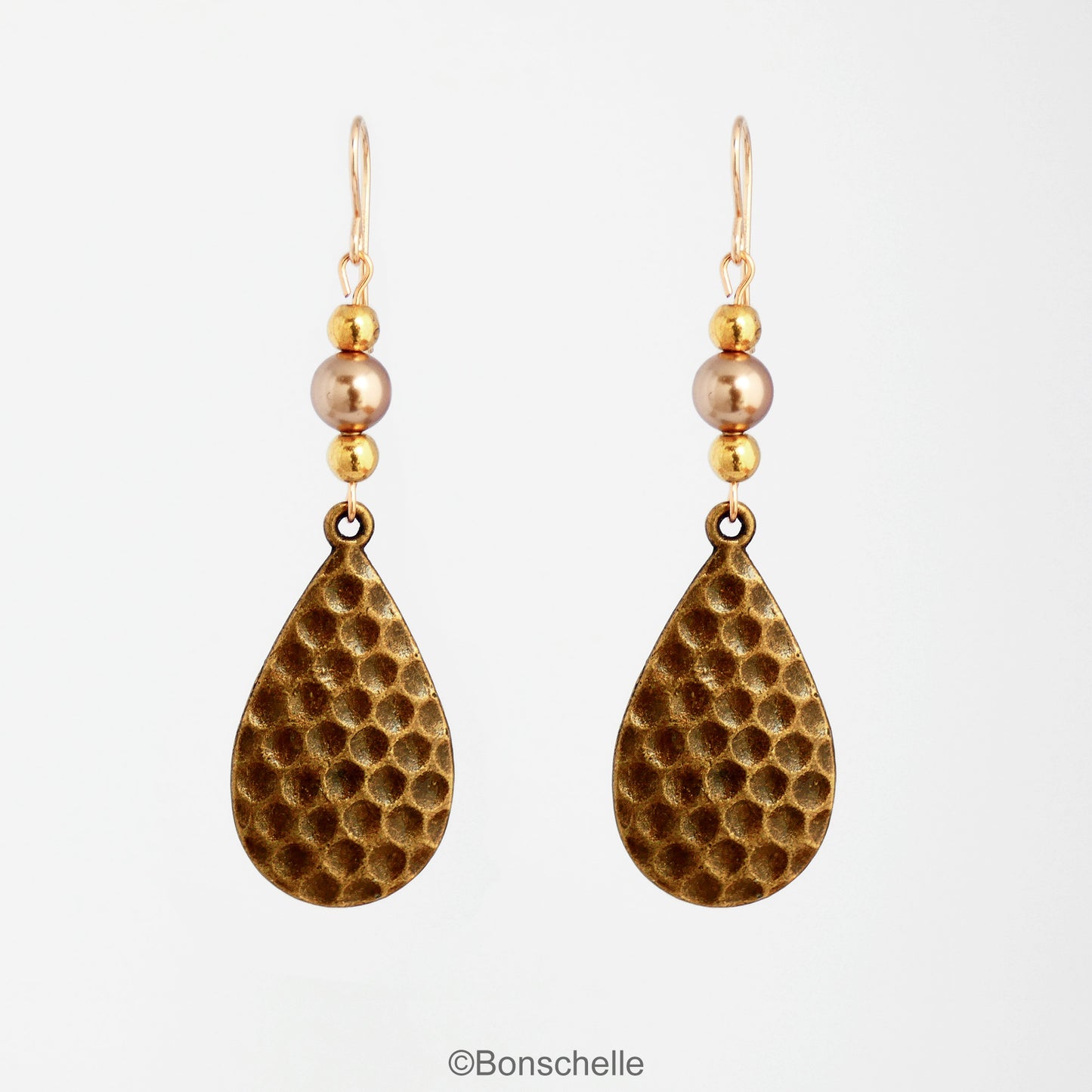 Antique bronze toned hammered metal teardrop earrings with bronze swarovski pearls, gold toned beads adn 14K gold filled earwires 