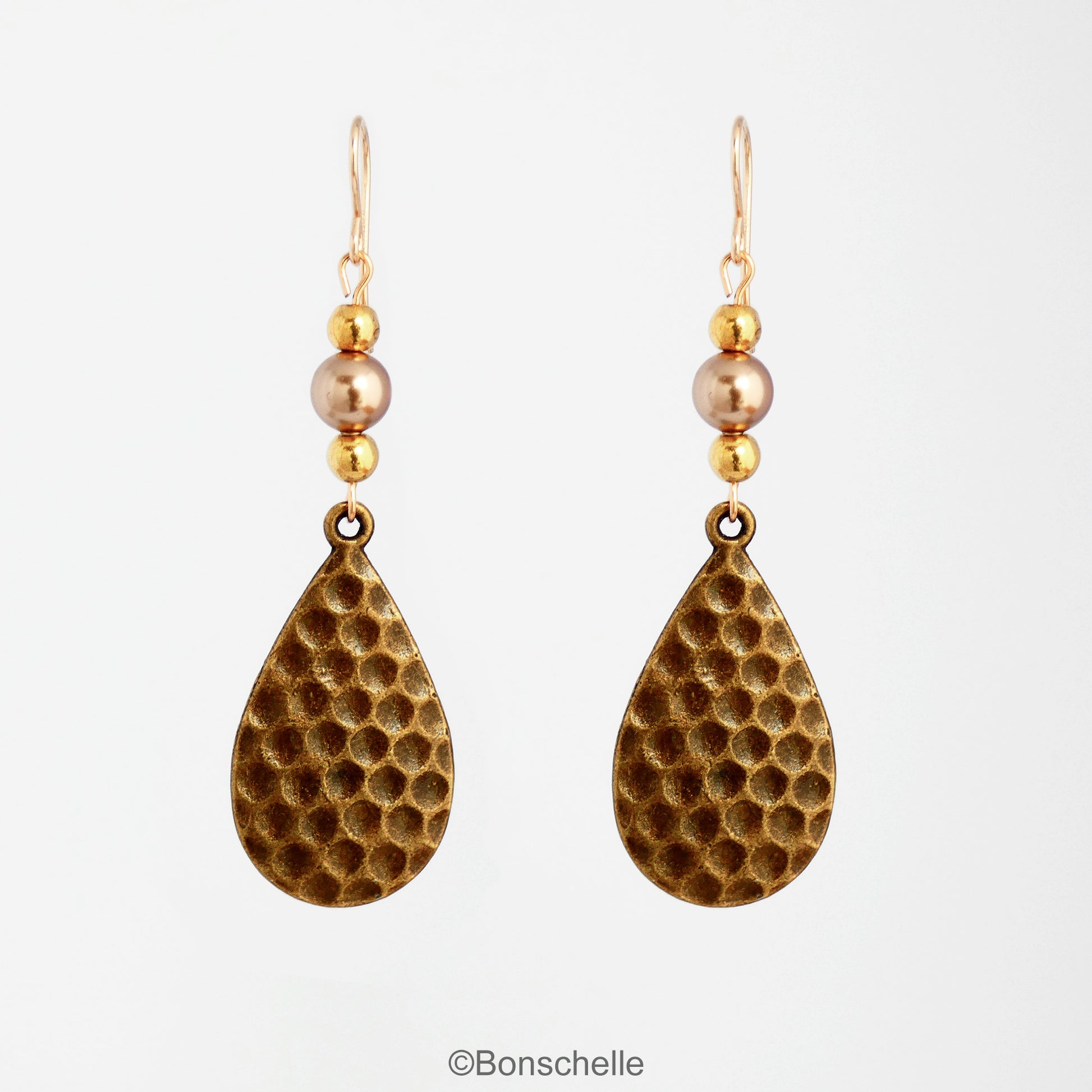Antique bronze toned hammered metal teardrop earrings with bronze swarovski pearls, gold toned beads adn 14K gold filled earwires 