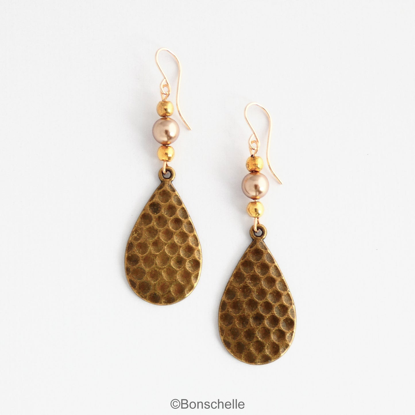 Antique bronze toned hammered metal teardrop earrings with bronze swarovski pearls, gold toned beads adn 14K gold filled earwires 