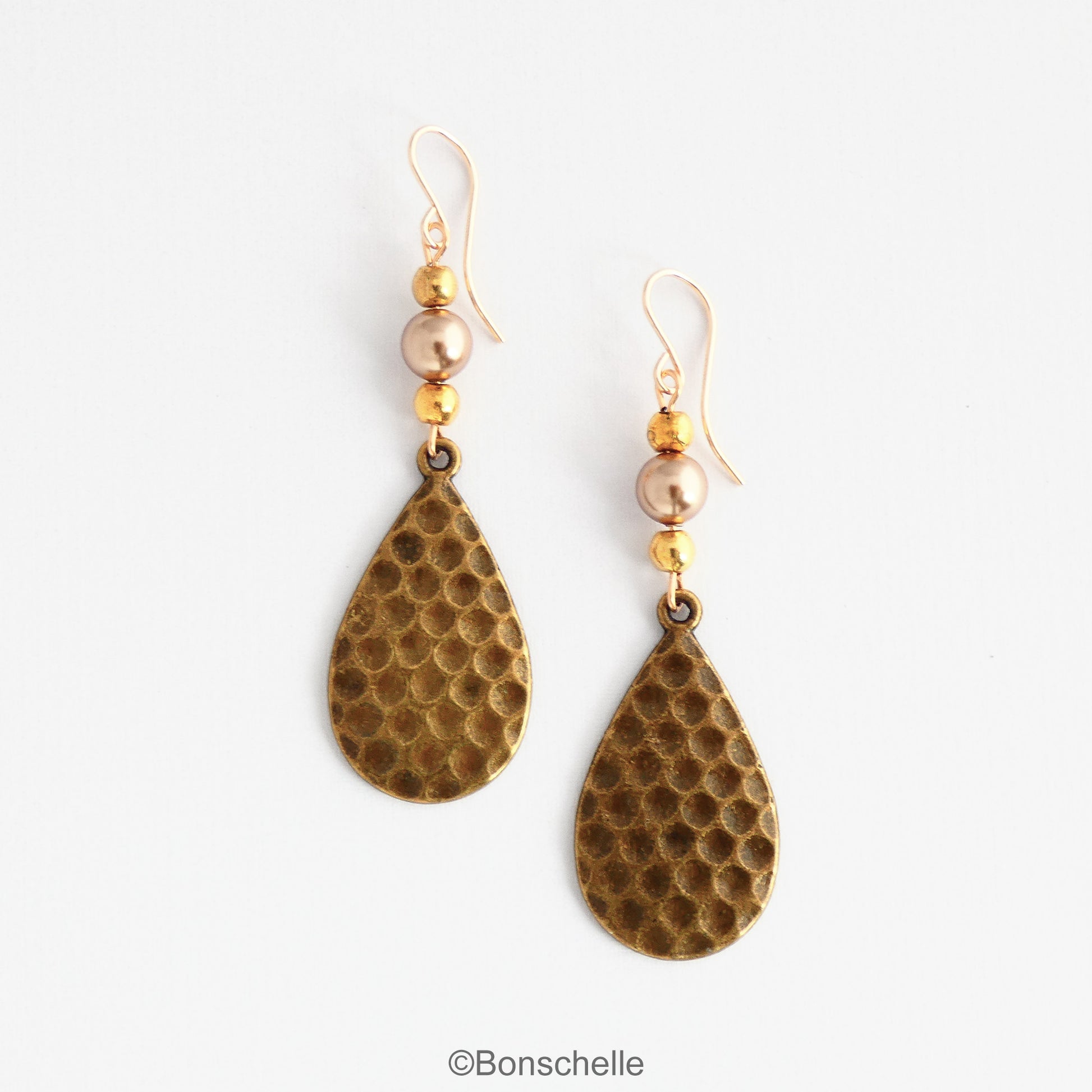 Antique bronze toned hammered metal teardrop earrings with bronze swarovski pearls, gold toned beads adn 14K gold filled earwires 