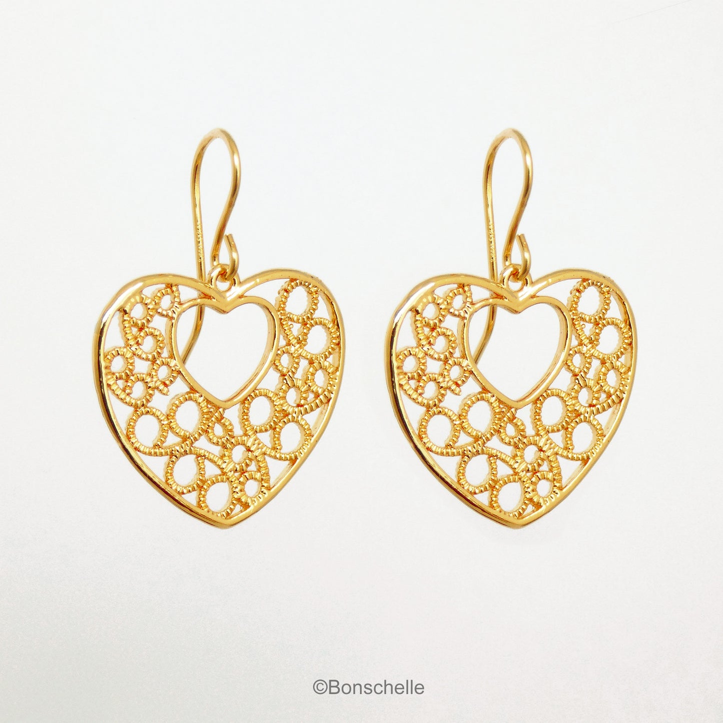 18K gold plated filigree heart earrings with 14K gold filled earwires shown hanging