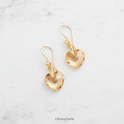 handmade earrings made with pale golden toned crystal cut heart beads and 14K gold filled earwires