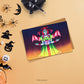 Gothic Vampire Lolita Postcard Art Print  on a table with halloween items