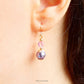 lavender and pink earrings handmade wtih Swarovski simulated pearls and clear pink swarovski crystal beads, with 14K gold filled earwires for women shown being worn