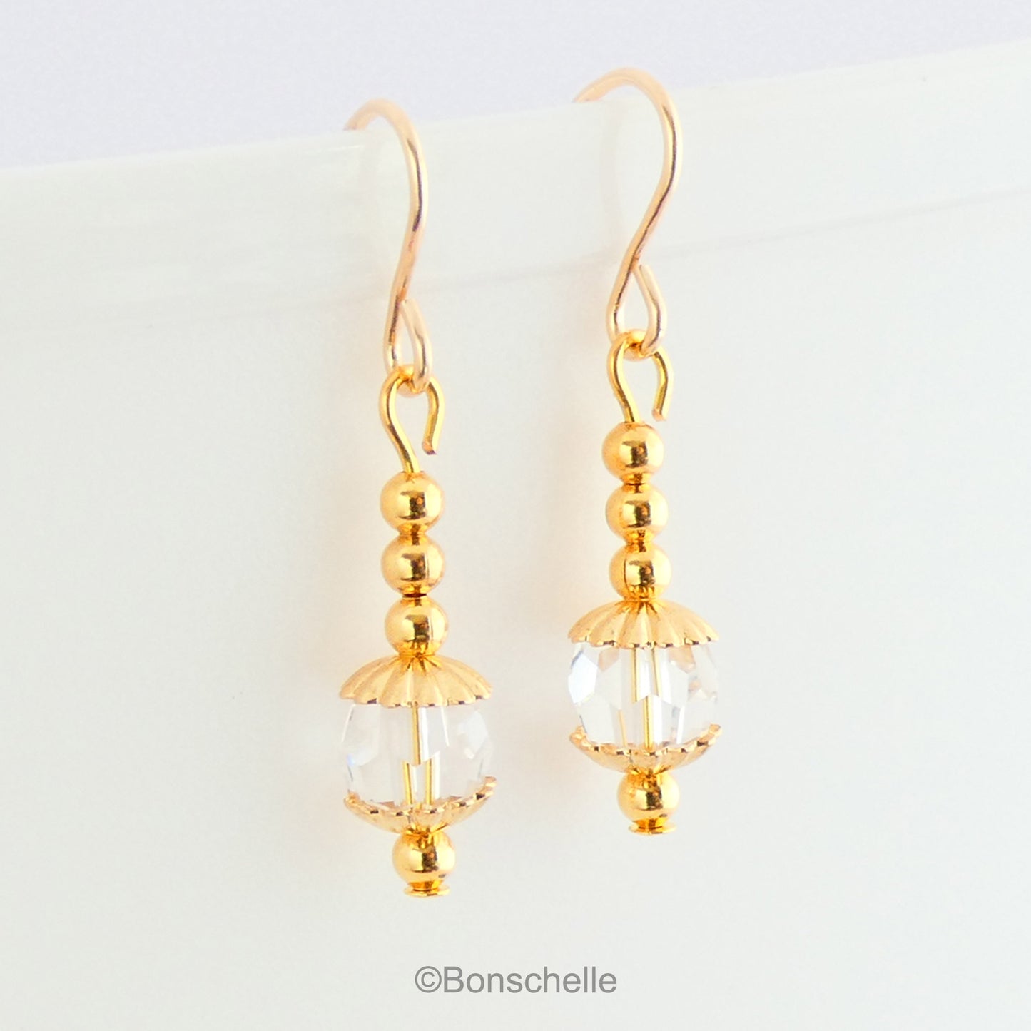 Handmade earrings with clear Swarovksi faceted crystall glass beads, gold tone small beads adn 14K gold filled earwires