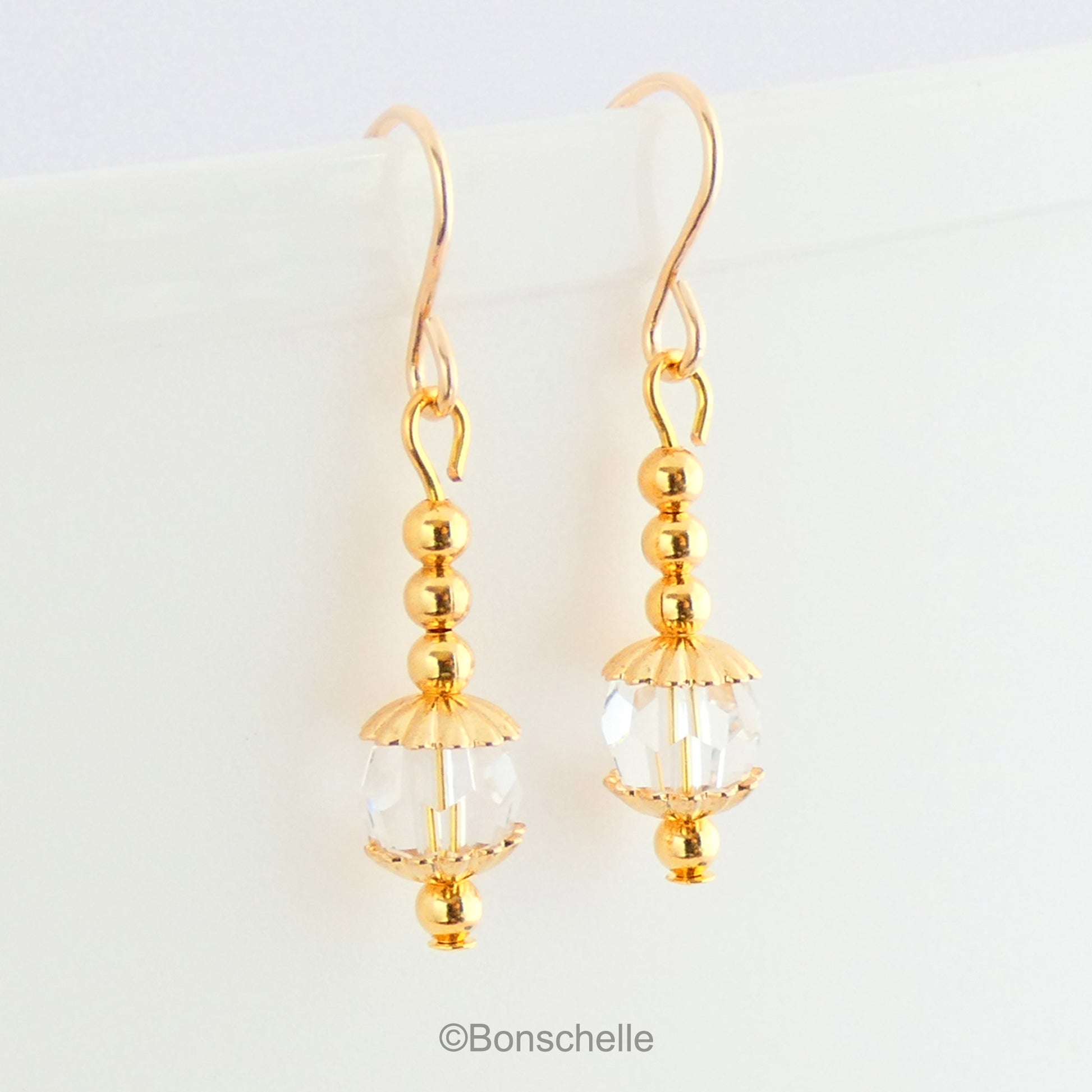 Handmade earrings with clear Swarovksi faceted crystall glass beads, gold tone small beads adn 14K gold filled earwires
