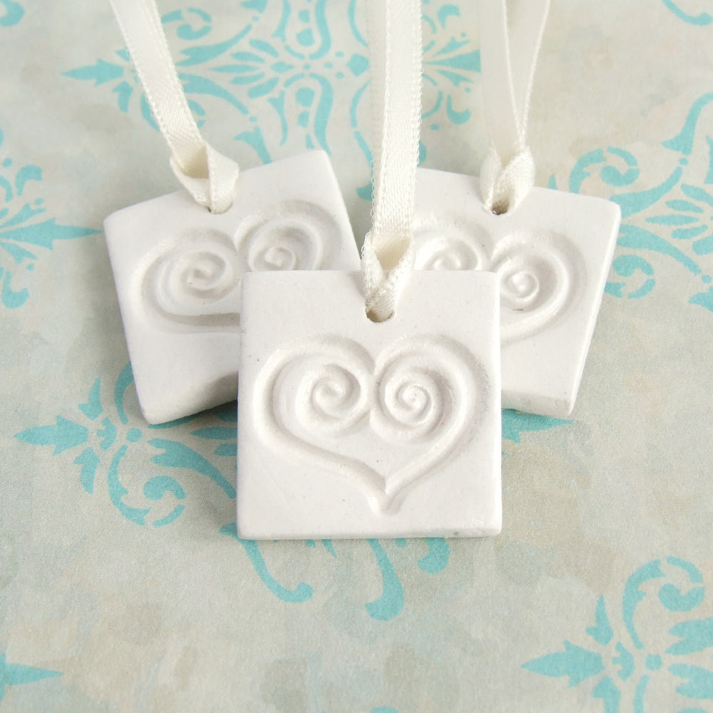 3 square white clay gift tag ornament favors with heart imprint and satin ribbon