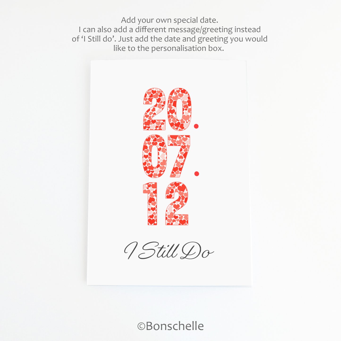 Front view of a handmade greeting Card with a personalised date in heart patterned numbers and the words 'I Still Do' beneath on the front, with a brown envelope and ordering instruction.