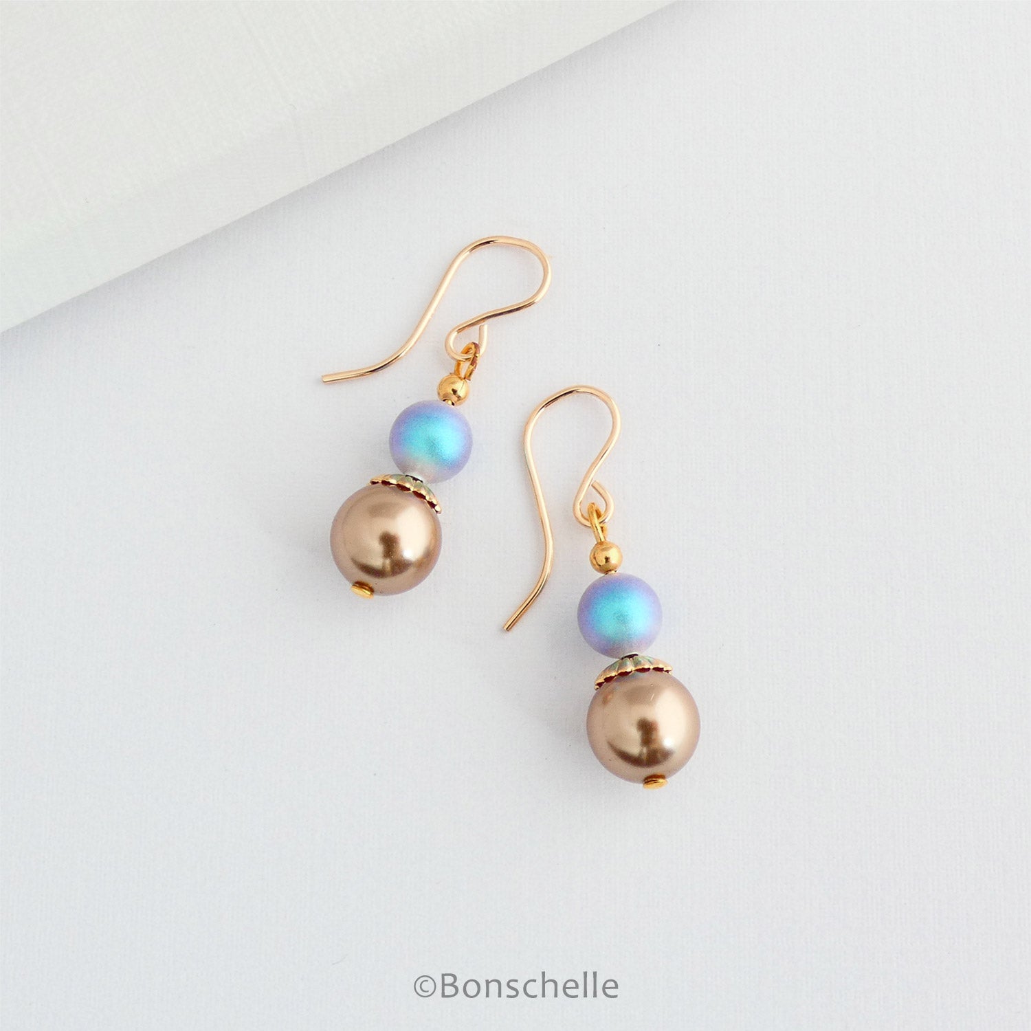 Women's bronze pearl and blue irridescent pearl earrings
